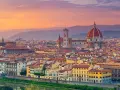 Panorama di Firenze al tramonto, con il Duomo e Palazzo Vecchio. Un'idea di cosa vedere a Firenze in un giorno, tra arte e storia.