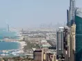 Panoramica di Dubai con grattacieli moderni, il Burj Al Arab e il mare. Ideale per scoprire cosa vedere a Dubai in 3 giorni.